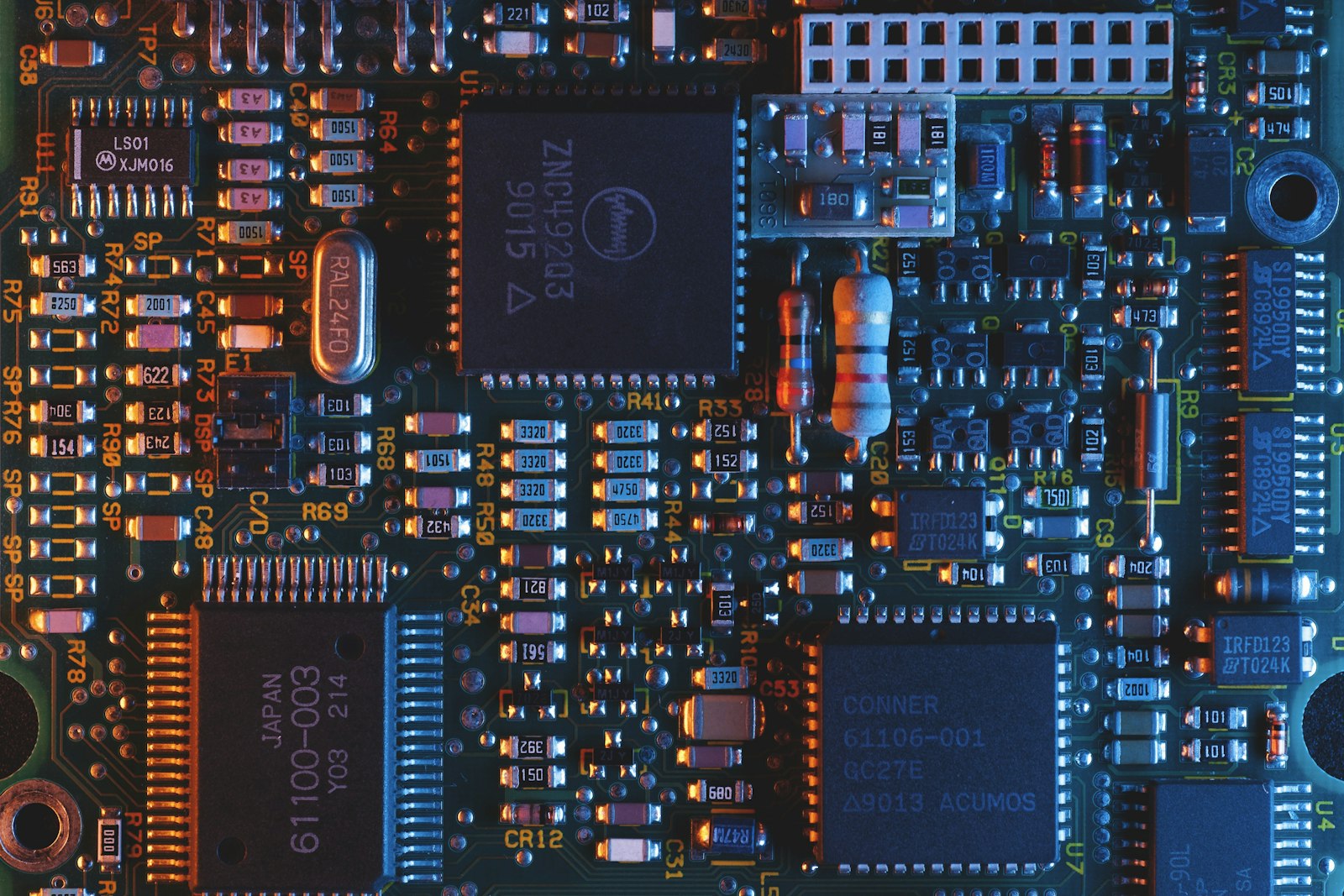 Extreme macro photograph of a circuit board showing gold traces and microchips, evoking machine-to-machine settlement