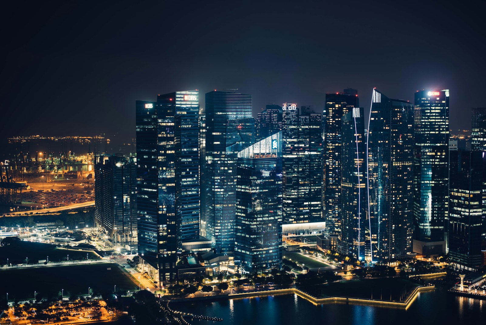 Financial district skyscrapers lit up against the night sky